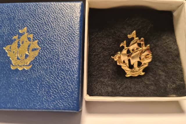Luke's prestigious gold Blue Peter badge.